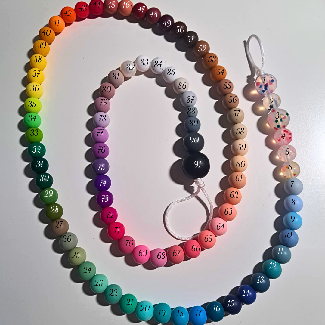 Attache-suce avec jouets de dentition