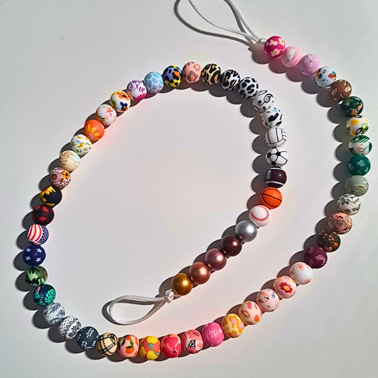 Attache-suce avec jouets de dentition